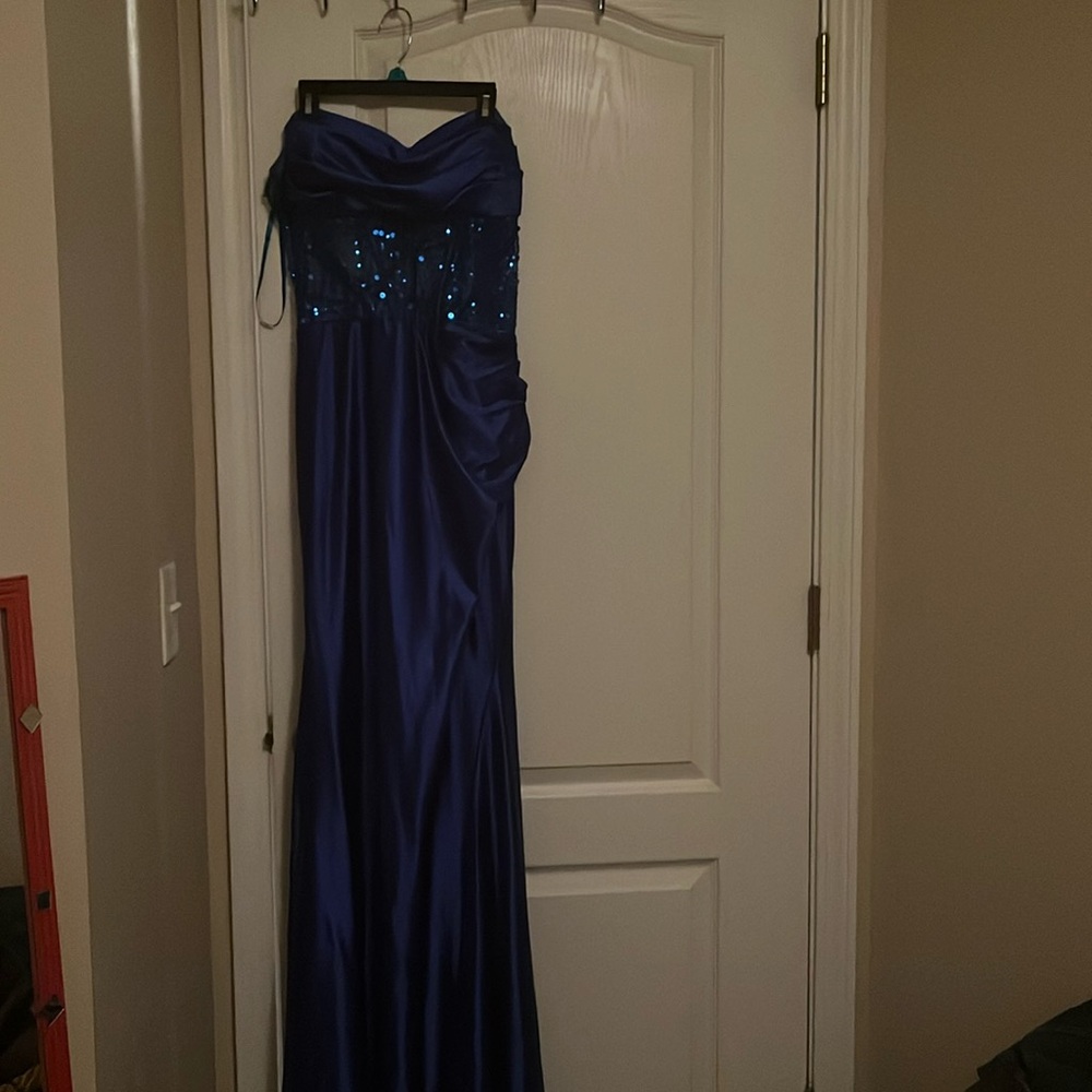 This is a size 12 Royal blue Villoni brand prom dress, with a slit on the right.